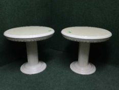 A pair of high gloss pedestal occasional tables