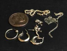 A 9ct gold heart pendant on chain, a 9ct gold chain, several yellow metal earrings (5.
