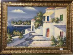 A gilt framed oil on board depicting a coastal villa