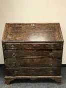 A late 18th century oak bureau,