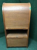 A mid 20th century teak shutter door cabinet