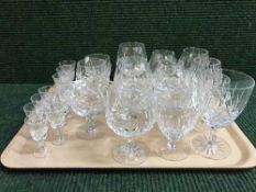 A tray of assorted lead crystal drinking glasses