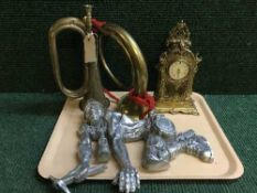 A tray of two copper horns,