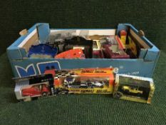 A box of assorted boxed die cast vehicles - Matchbox Formula 1 car transporter,