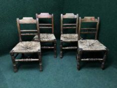 A set of four rush seated kitchen chairs