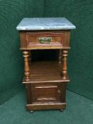 A late Victorian marble topped bedside stand
