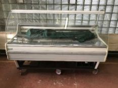 A refrigerated glazed shop display counter