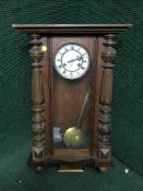 An early 20th century mahogany wall clock