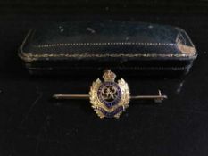 A 9ct gold and enanmel Royal Engineer's bar brooch with emblem, in fitted tooled leather box, 4.