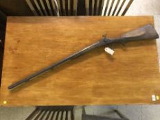 A late 19th century double barrel shotgun with ramrod a/f