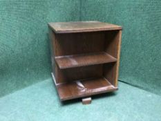 A 1930's oak revolving book table