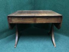A sofa table fitted two drawers