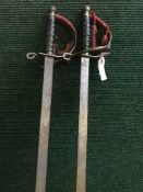 A pair basket handled swords,