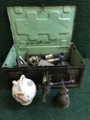 An amunition crate of antique metal kettle, foot pump,