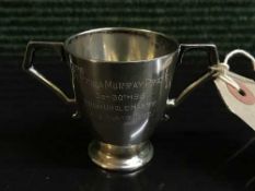 A small Brittania silver twin handled christening mug