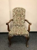 A continental mahogany gentleman's armchair on pad feet