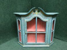 A hand painted hanging wall cabinet