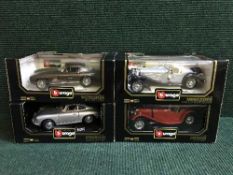 Four boxed Burago large scale die cast vehicles