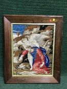 A rosewood framed tapestry of a religious scene