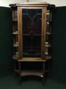 An unusual mahogany display cabinet