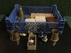 A basket of Robertson's figures, cut throat razor, brass ornaments,