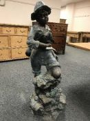 An impressive bronze figural fountain depicting a boy holding a fish with rod,