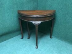 A Georgian style d-shaped mahogany pad foot card table,