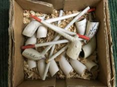 A collection of antique clay pipes
