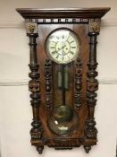 A 19th century mahogany wall clock with enamelled dial