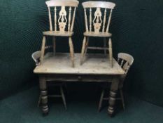A pine farmhouse kitchen table and four chairs