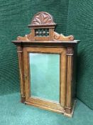 A late 19th century mirrored pine wall cabinet