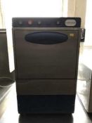 A bench top stainless steel glass washer