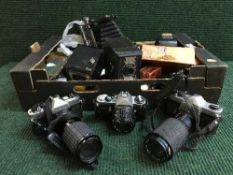 Four boxes of assorted cameras, accessories, camera cases,