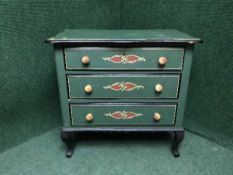 A hand painted serpentine fronted three drawer chest