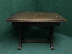 An oak refectory extending dining table