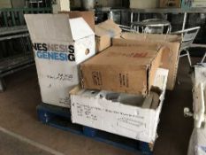 A pallet of assorted toilets,