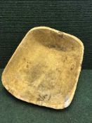 A rustic pine dough bowl