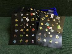 A collection of enamelled pin badges