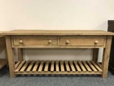 A reclaimed pine two drawer pine farmhouse table,