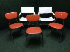 A pair of white leather armchairs,