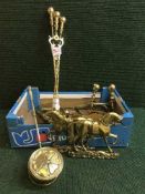 A box of brass fire dogs, companion set, chestnut warmer,