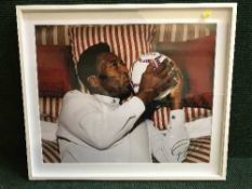 A framed signed photograph - Pele