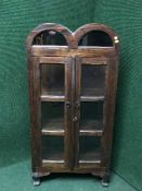 A domed topped display cabinet