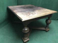 A late nineteenth century continental oak pull out dining table with two leaves