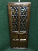AN oak leaded door corner cabinet