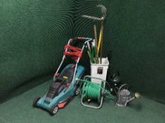 A Bosch electric mower, bucket of garden tools,
