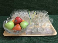 A tray of assorted drinking glasses, fruit bowl,