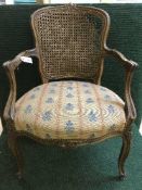 A carved walnut armchair