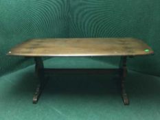 An Ercol elm refectory table