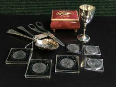 An Italian music box together with a silver plated goblet, silver plated berry spoons,